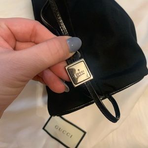 Guccis canvas drawstring bag comes with dust bag